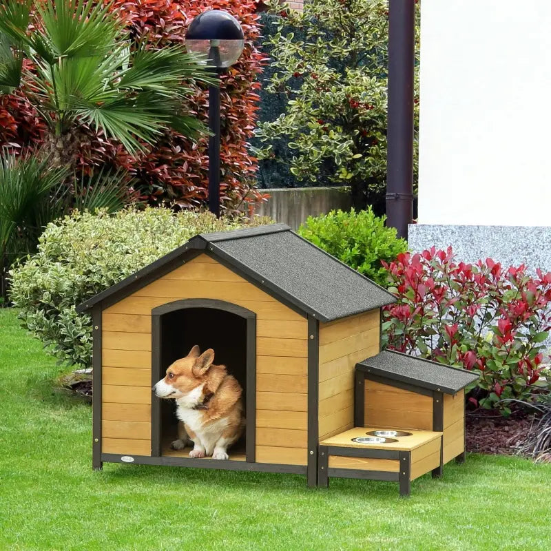 PawHut Wooden Outdoor Dog House, Cabin-Style Pet House with Feeding Bowls, Asphalt Roof, Storage Box for Dogs Up To 66 Lbs., Natural